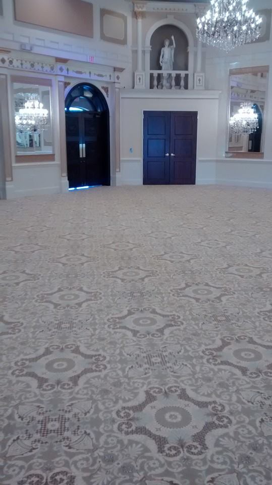 Grand Ballroom with ornate patterned carpet flooring in a luxurious setting.